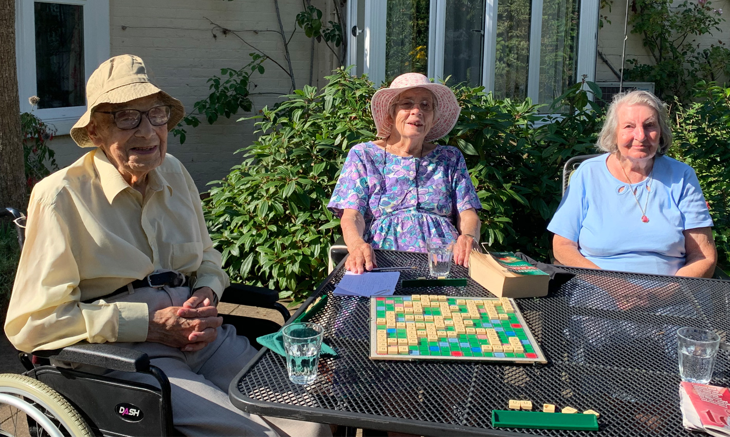 Residents playing Scrabble in the sunshine