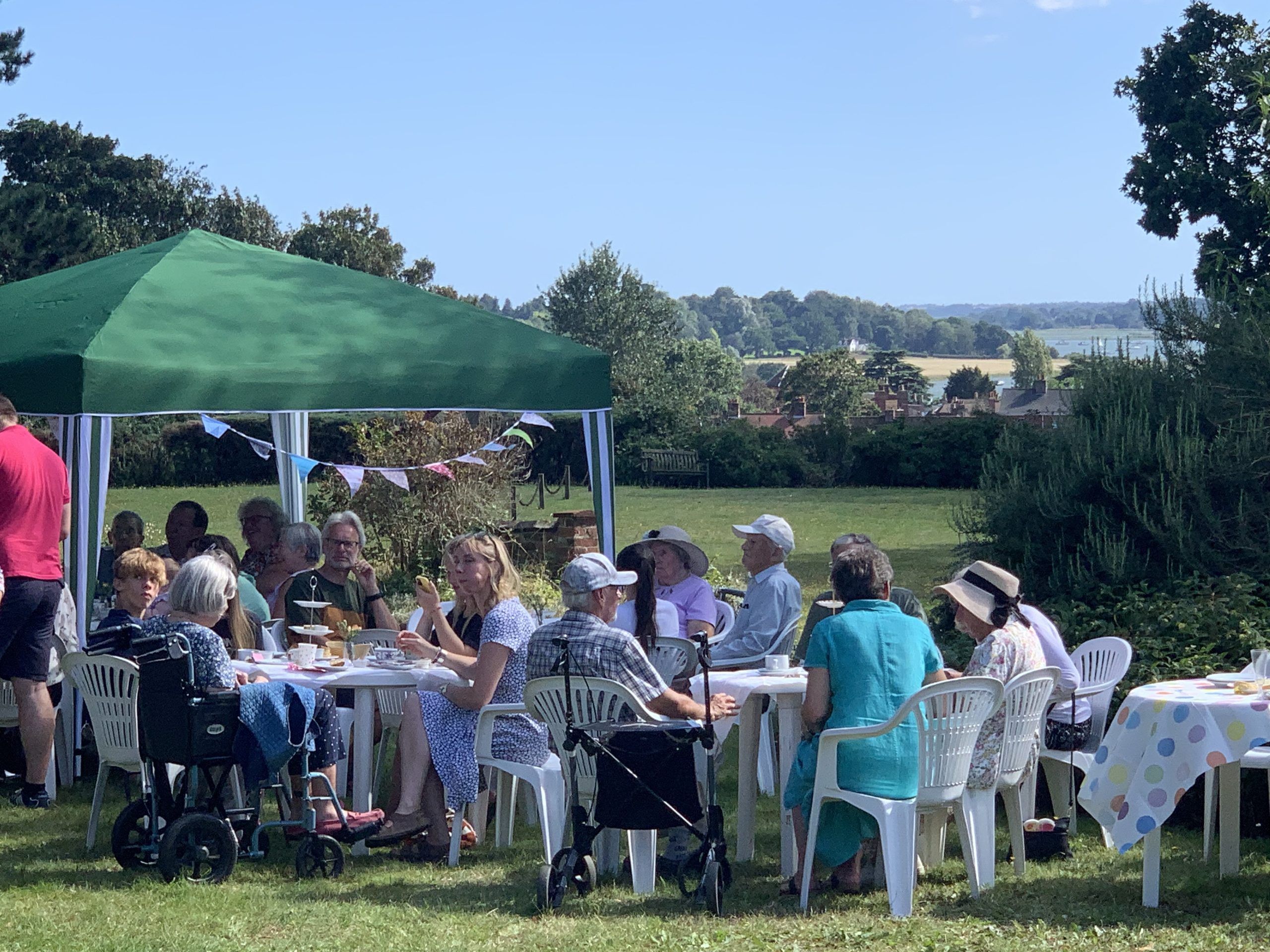 Everyone enjoying the view and the cream tea at Highlands Summer party